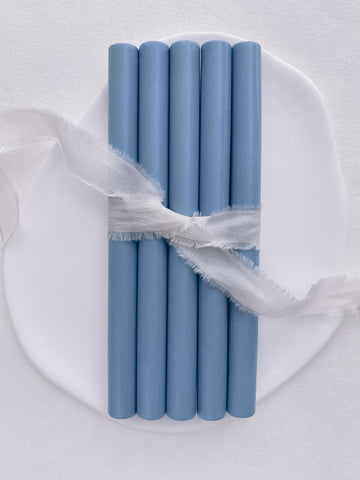 a set of 5 dusty blue sealing wax sticks