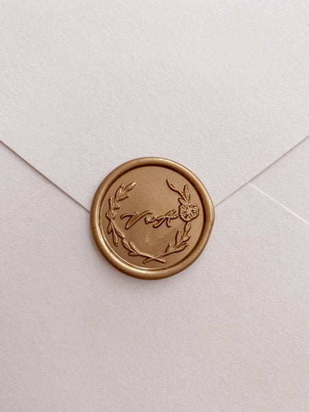 Garden wreath monogram wax seal in gold on paper envelope