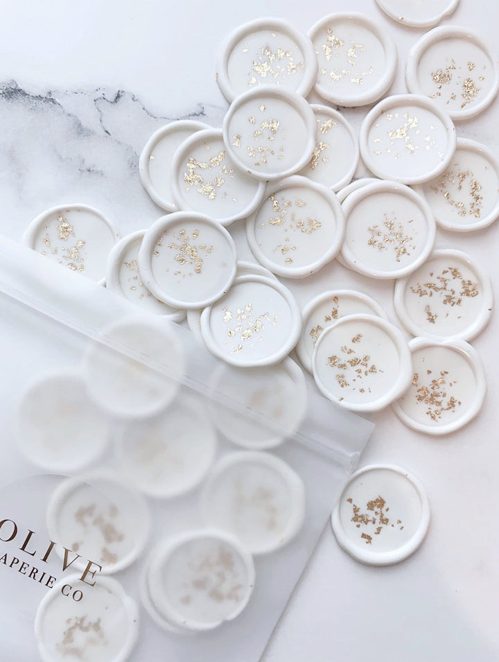 a bundle of gold leaf white wax seals out of packaging bag