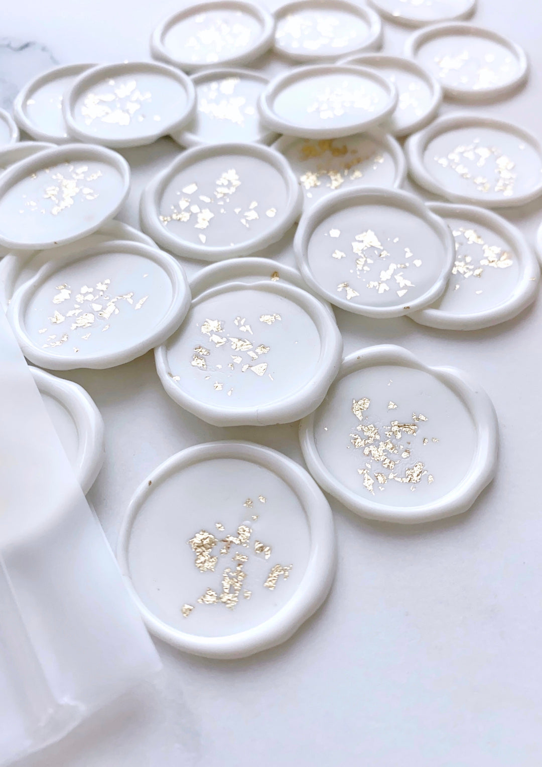 a bundle of gold leaf white wax seals 