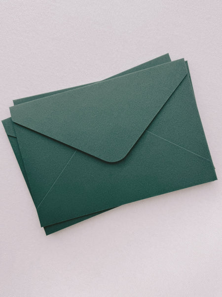 stack of green envelopes