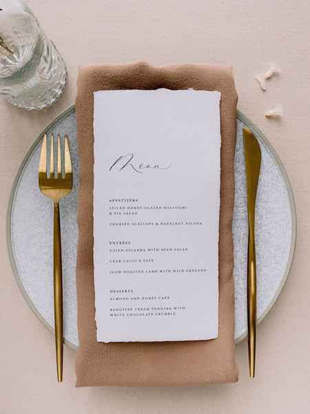 Handmade paper menu with natural deckled edges on table setting_front angle in design 2