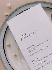 Handmade paper menu with natural deckled edges_side angle