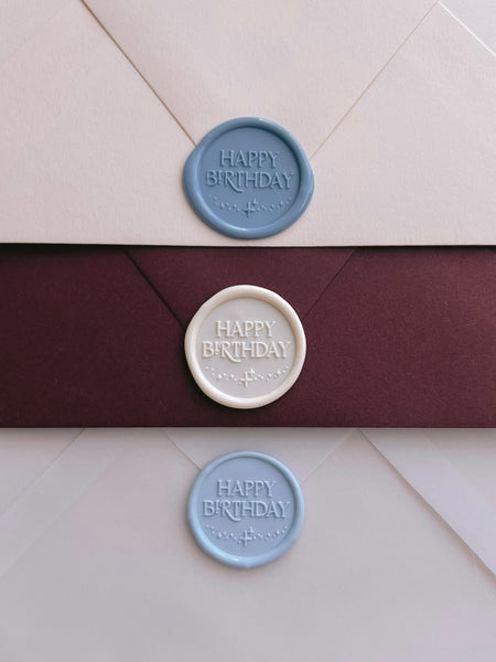 happy birthday wax seals in dusty blue, white and light blue 