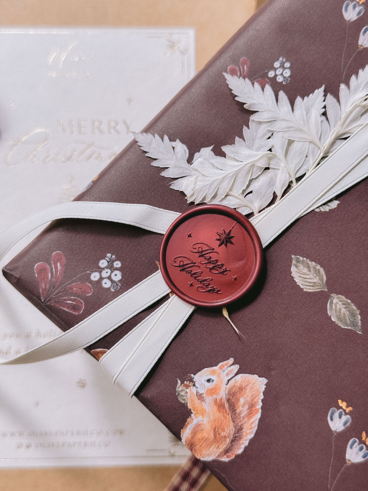 A dark metallic red wax seal that reads &