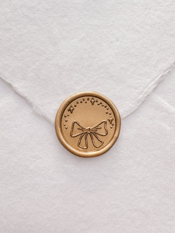 Christmas ribbon bow gold wax seal