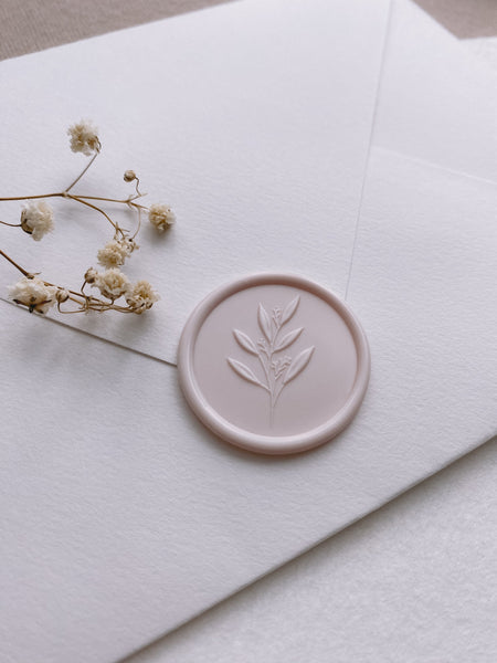 Nude 3D leaf branch wax seal on white envelope