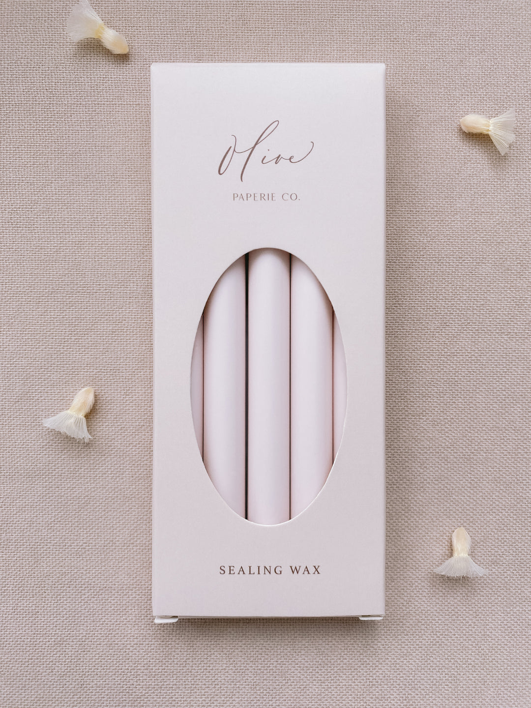 a box of 5 glue gun sealing wax sticks in ivory nude color