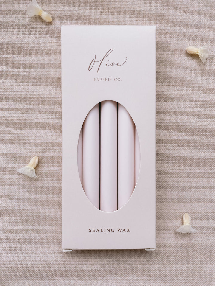 a box of 5 glue gun sealing wax sticks in ivory nude color