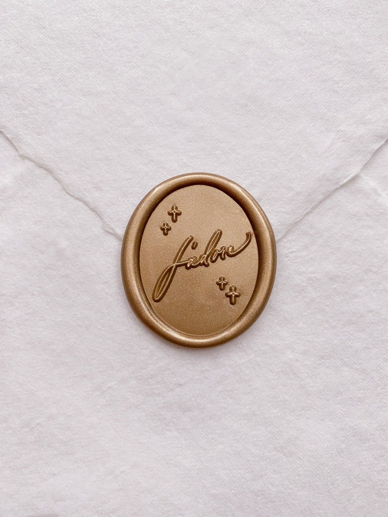 J'adore oval wax seal in gold on handmade paper envelope