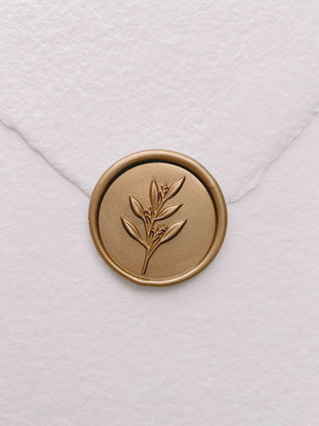 3D leaf branch wax seal in gold on handmade paper envelope_front angle