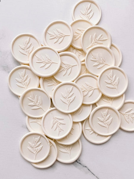 Leaf branch wax seals in light cream