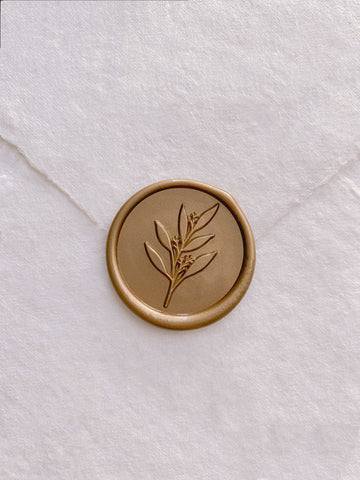 Gold leaf branch wax seal on white handmade paper envelope