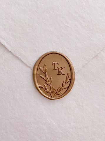 Oval leaves wreath monogram gold custom wax seal on beige handmade paper envelope