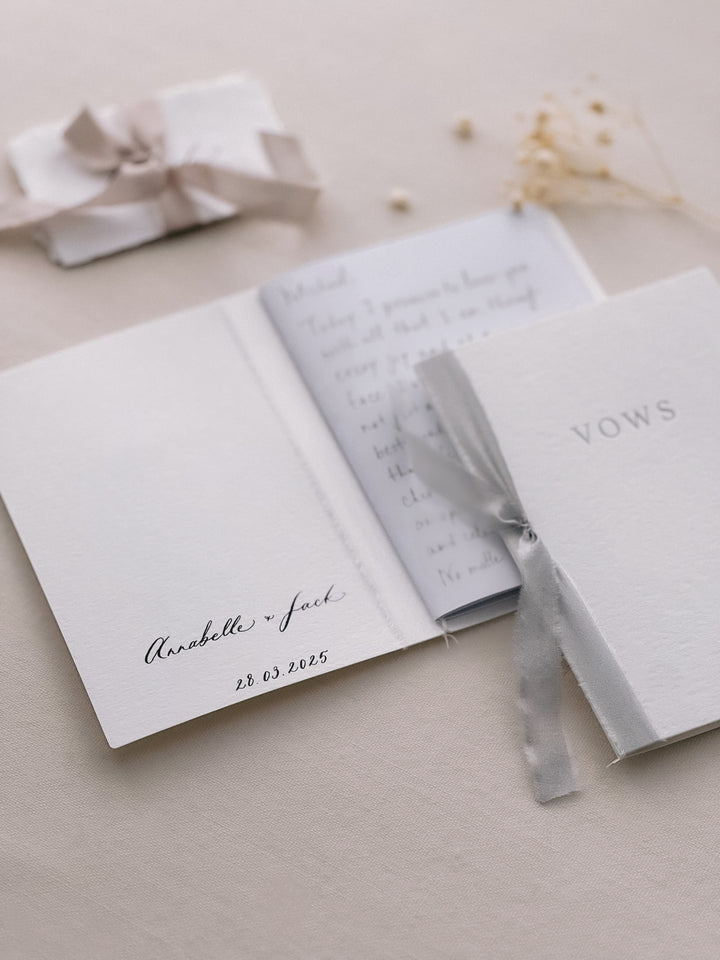 white vow books personalized with couple&