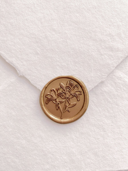 Lily round wax seal in gold on handmade paper envelope