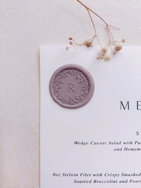 Floral crown single initial custom wax seals in mauve on wedding menu with dried flowers