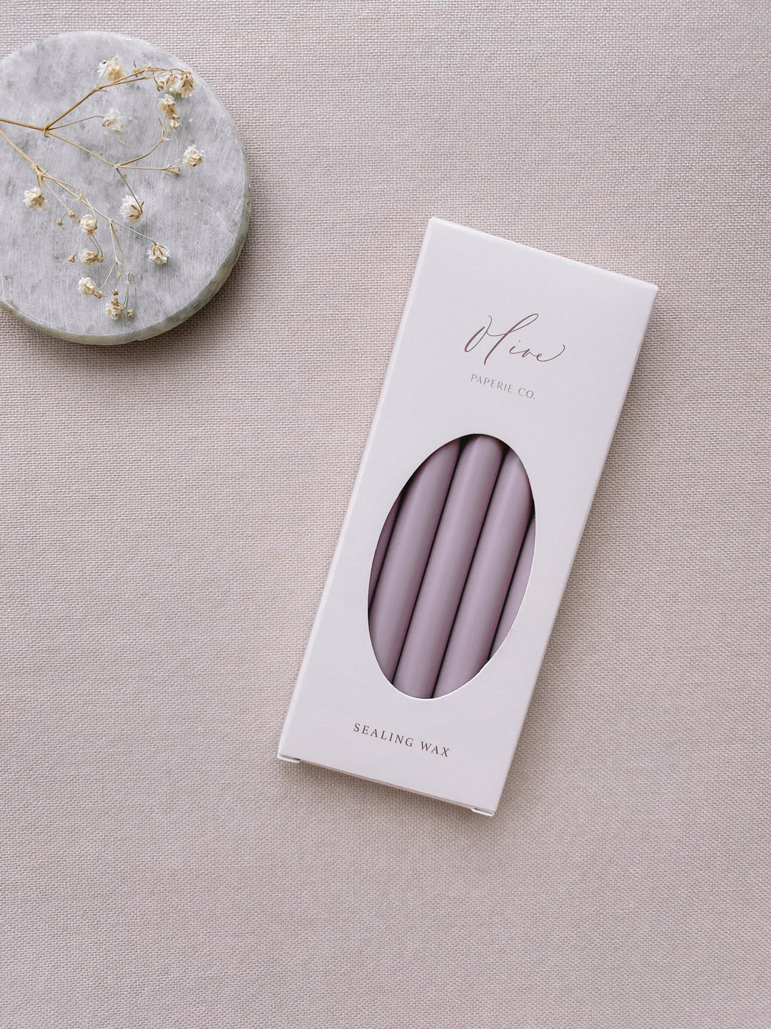 a box of 5 mauve sealing wax sticks_side angle