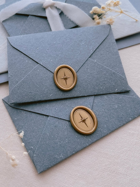 oval star mini gold wax seals on mini blue envelopes