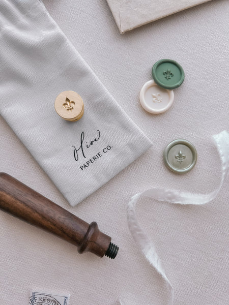 Fleur-de-lis mini wax seal stamp head and wax seals in various green and white colors