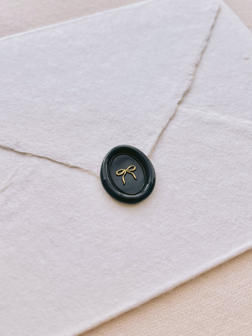 hand-drawn bow mini oval black wax seal with gold paint