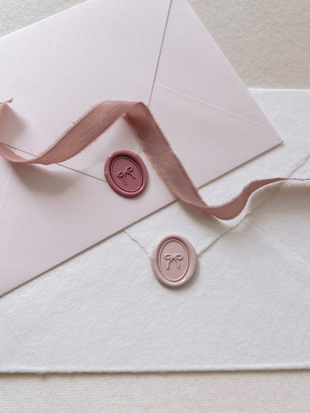 hand-drawn bow mini oval wax seals in dusty rose and light pink