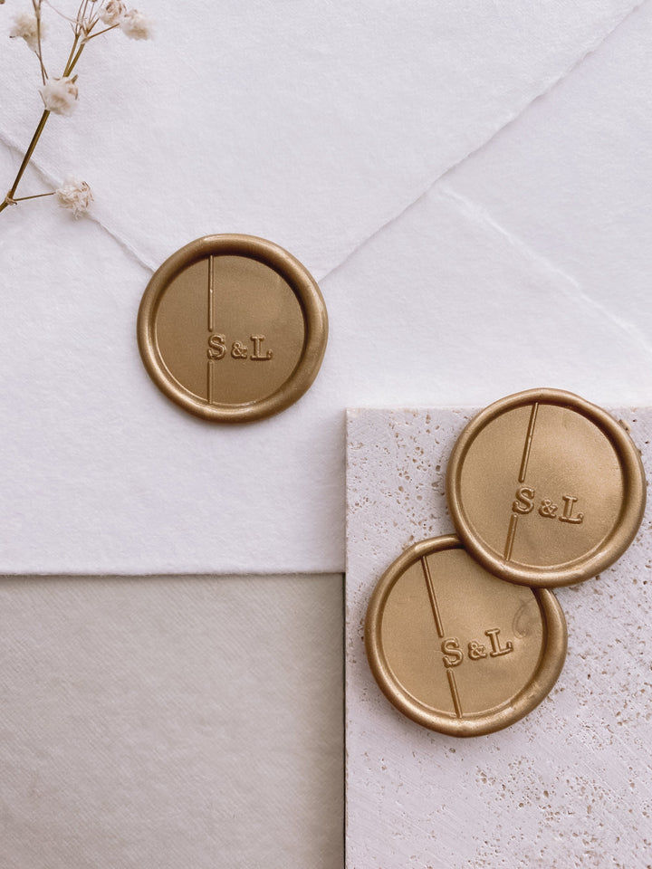 Moderne monogram wax seals in gold