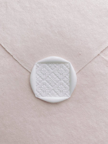 Nora moroccan tile wax seal in off white on handmade paper envelope