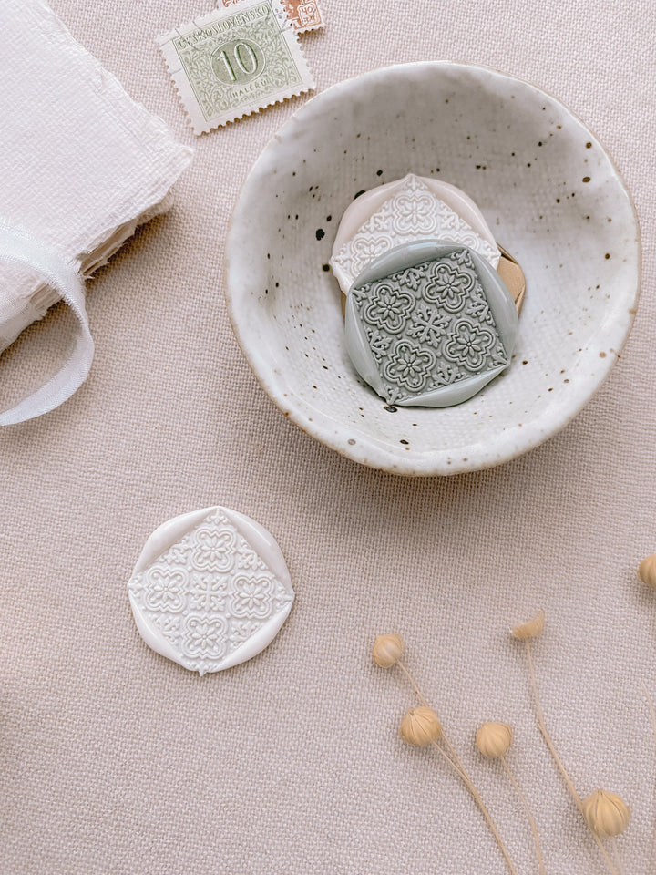 Moroccan tile pattern square shaped wax seals in white and sage green
