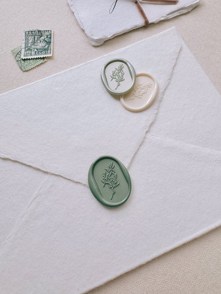 Oval arch shaped botanical wax seals in color light metallic green, sage green and off-white