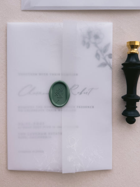 green oval botanical wax seal on vellum jacket