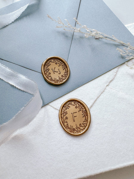 Gold oval floral wreath wax seals