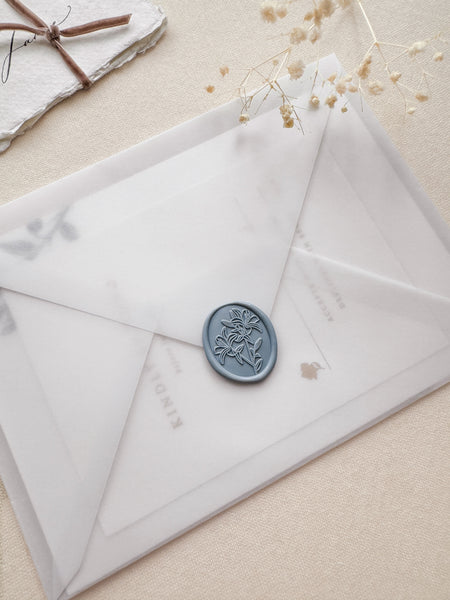 Oval lilies floral wax seal in color dusty blue on a vellum envelope