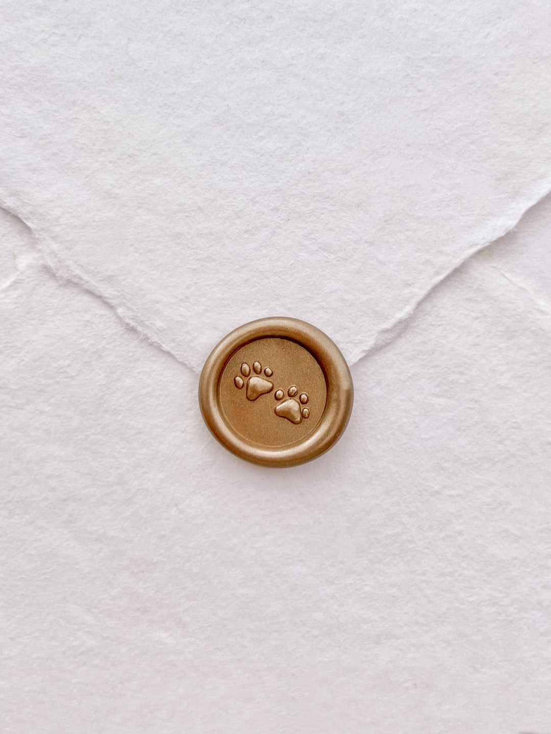 3D paw print mini gold wax seal on white handmade paper envelope 