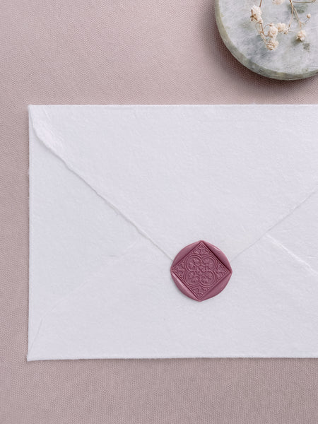 Square Morrocan tile wax seal in rosewood color on white handmade paper envelope