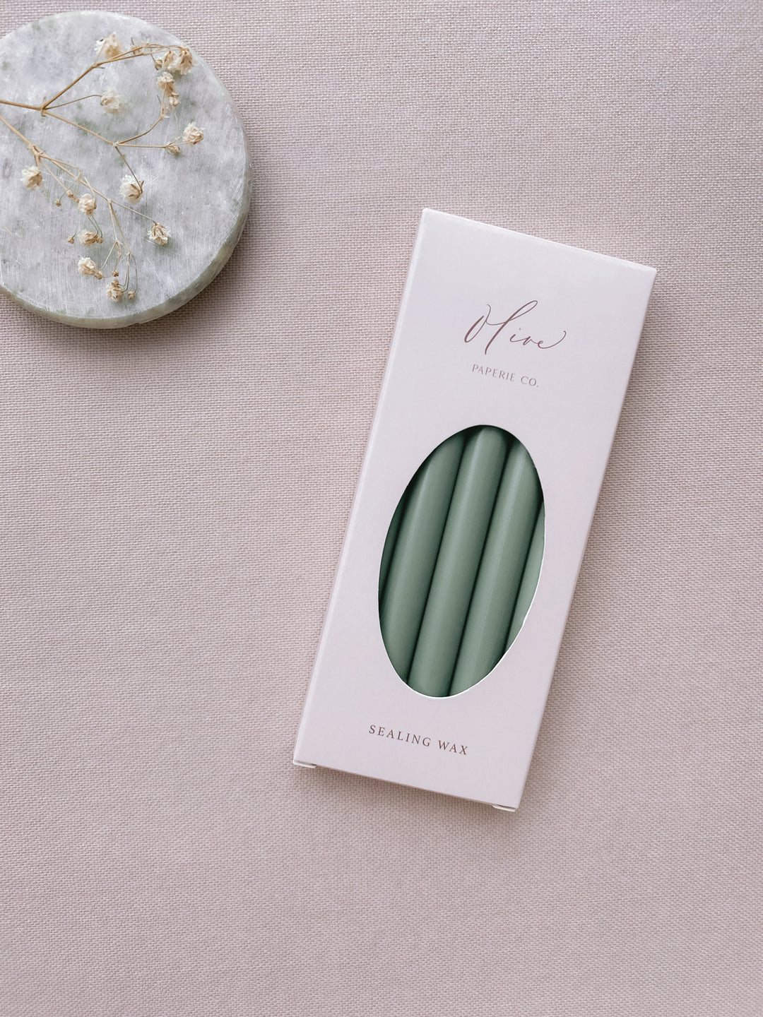 a box of 5 sage green sealing wax sticks_side angle