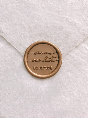 Custom wax seal with "Save our date" and personalized date in gold