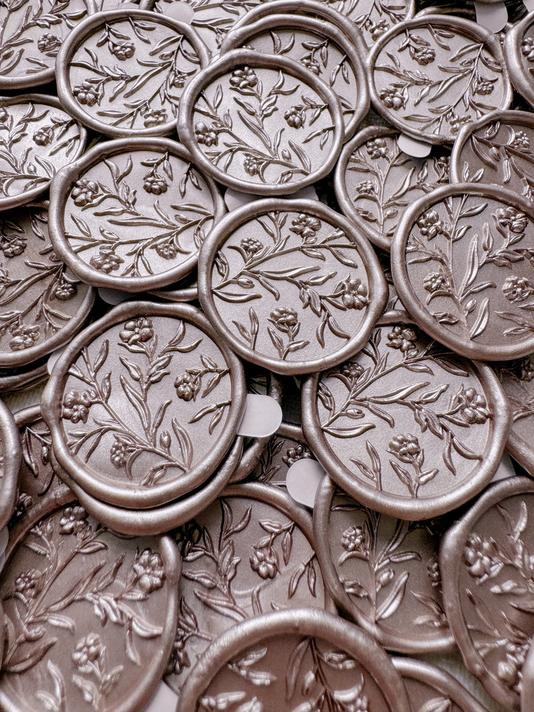 Floral wax seals with 3D engraving in color mocha with 3M adhesive backings attached