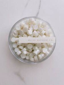 a box of white pearl color sealing wax beads