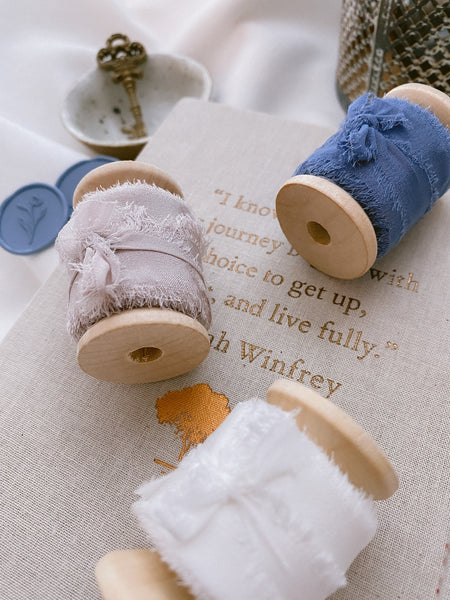 1 inch raw edge silk ribbon on wooden spools in color Soft White, Nude Grey and French Blue