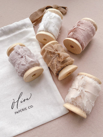 1 inch raw edge silk ribbons on wooden spools in color Soft White, Nude Grey, Dusty Blush, Latte and Cream White