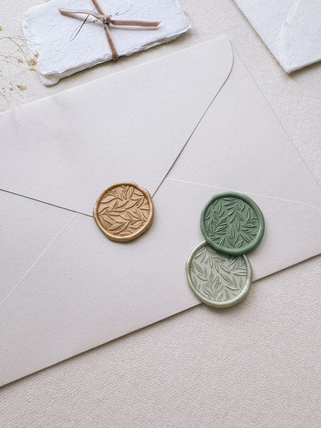 leaf pattern wax seals in gold, green and metallic light green