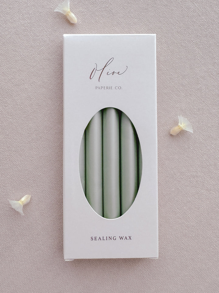 Light metallic sage green sealing wax sticks in a box