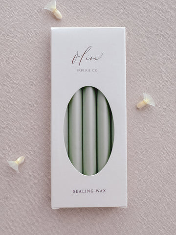 Light metallic sage green sealing wax sticks in a box