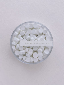 a box of snow color sealing wax beads