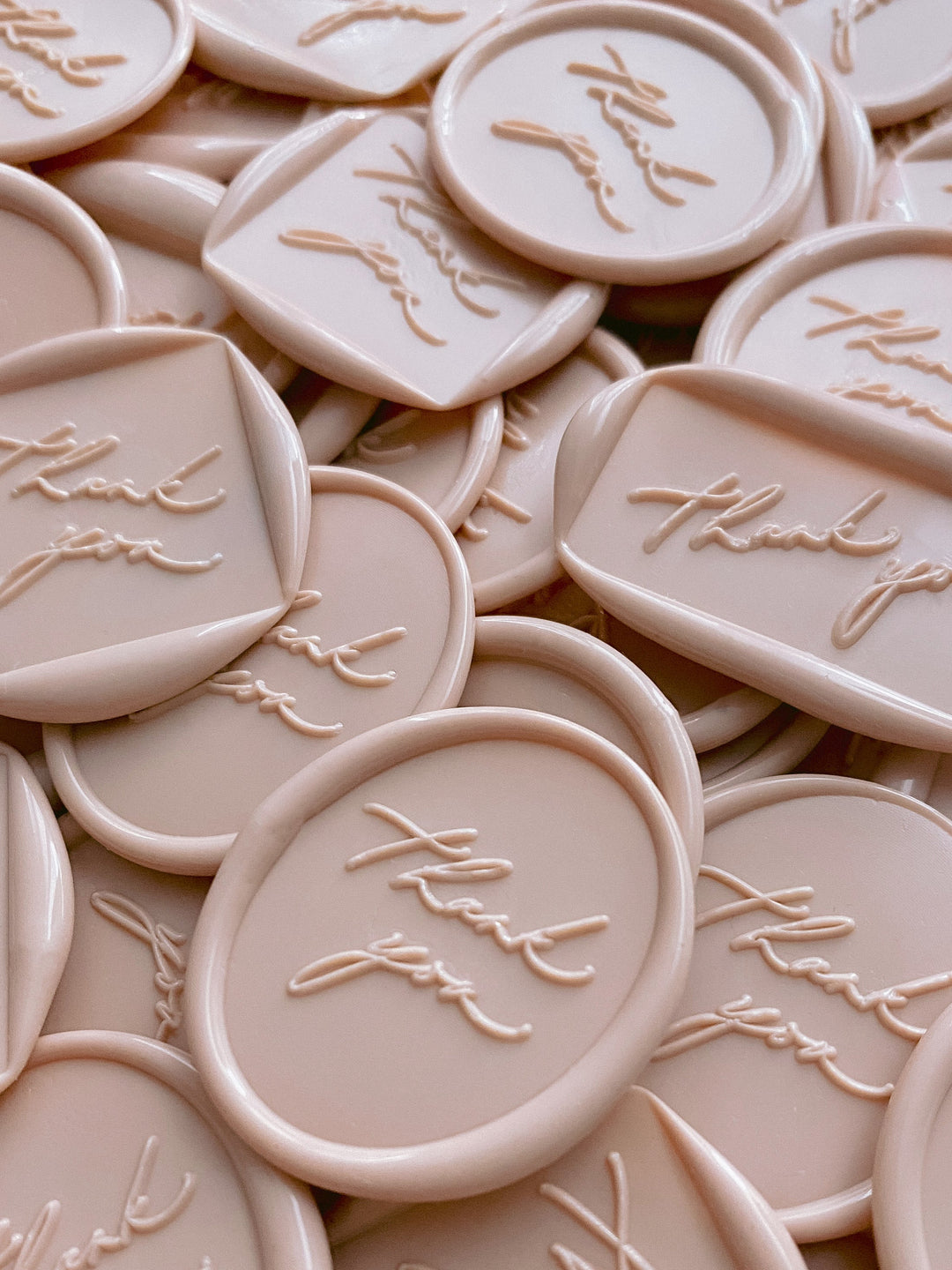 Thank you wax seals in oval, round, diamond and rectangle in nude wax color close up