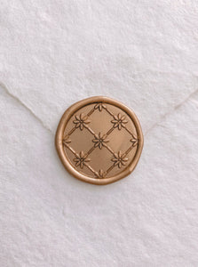 Daisy flower pattern wax seal in gold on handmade paper envelope