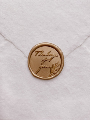 Gold thinking of you with leaf design wax seal on white handmade paper enveloipe