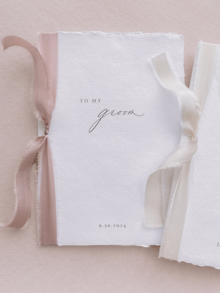 to my groom to my bride white wedding vow books tied in pink and off-white silk ribbons