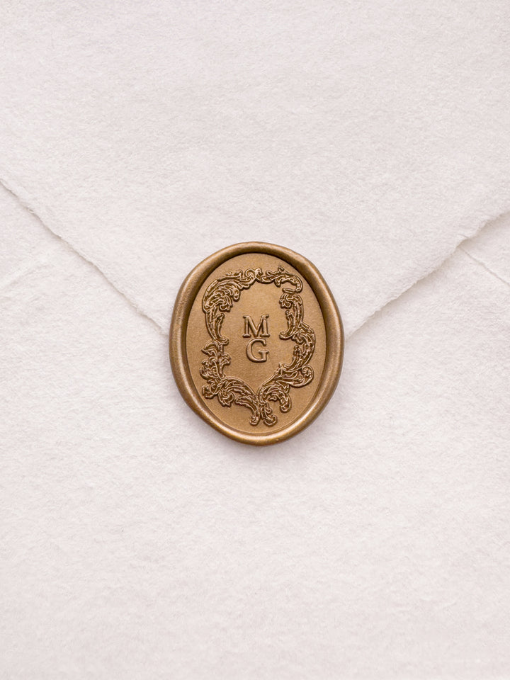 gold vintage crest personalized initials wax seal on a white envelope